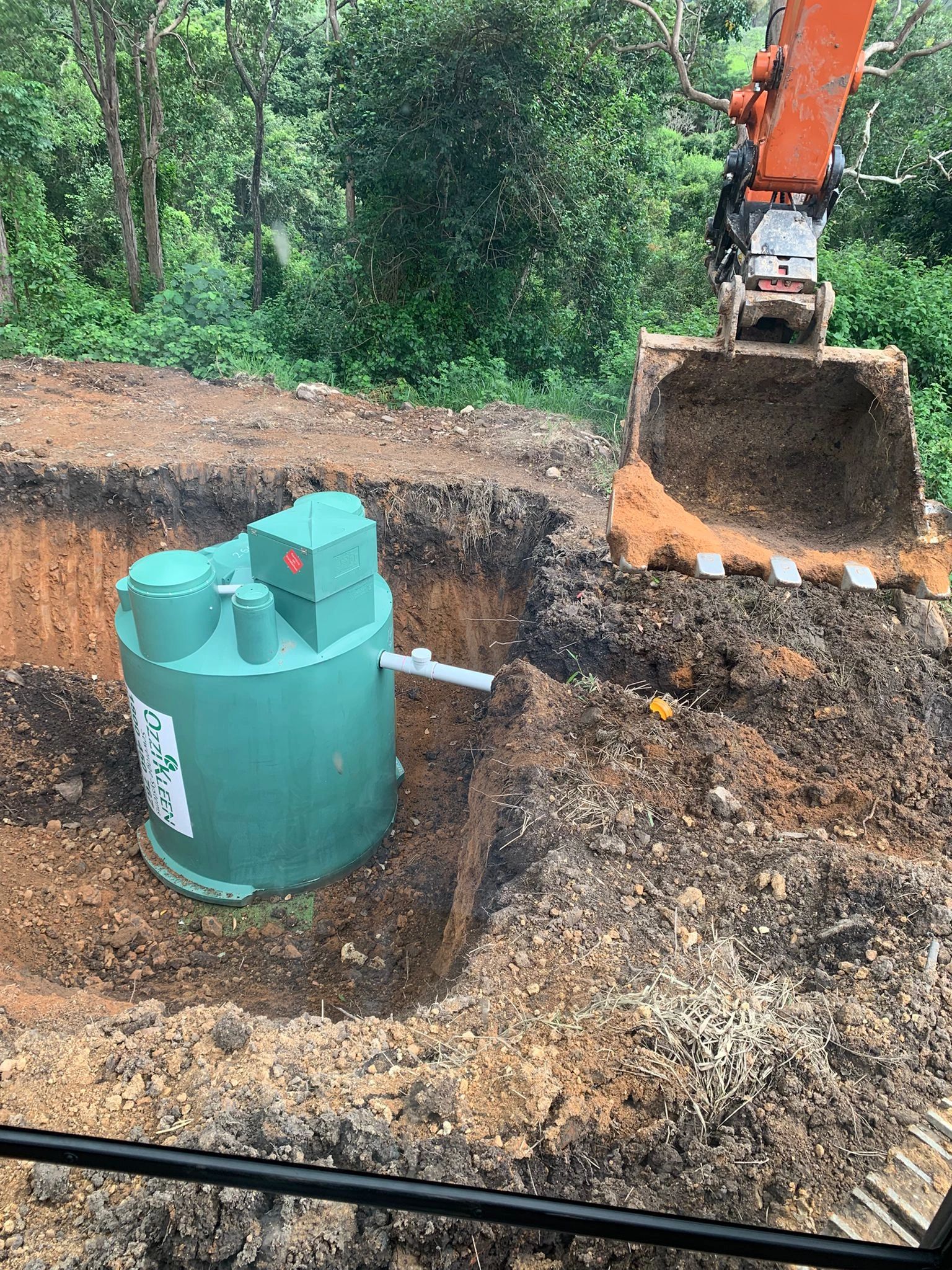 Septic system installation with excavator