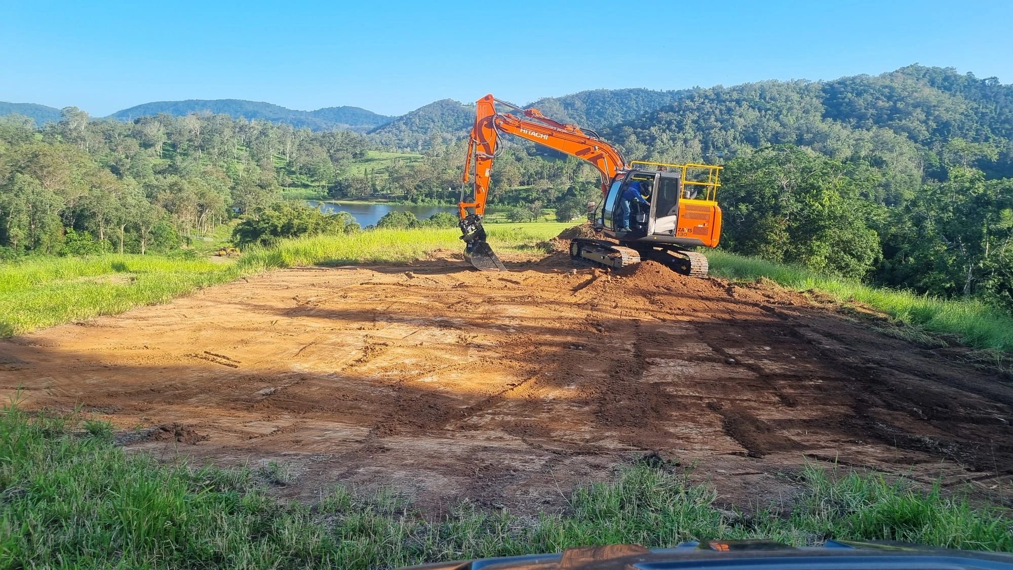 Excavator working on a Queensland earthmoving project